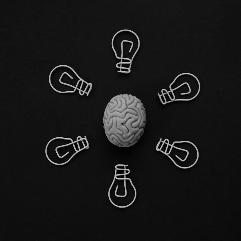 illustration of brain surrounded by light bulbs